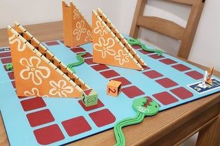 Real Spongebob Eels and Escalators Board Game!: 8 Steps (with Pictures) Eels And Escalators, Game Controller Storage, Diy Controller, Spongebob Crafts, Spongebob Birthday Party Decorations, Controller Storage, Spongebob Games, Spongebob Episodes, Make Your Own Game