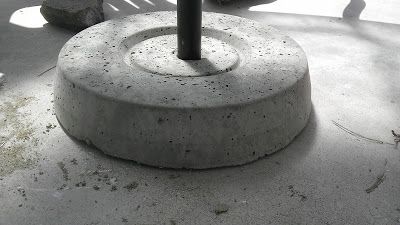 Christina and Ted Buy a House: DIY Concrete Umbrella Stand Diy Concrete Umbrella Base, Diy Umbrella Base, Patio Redo, Diy Umbrella, Boys Crafts, Diy Concrete Patio, Yard Oasis, Outdoor Umbrella Stand, Flower Containers