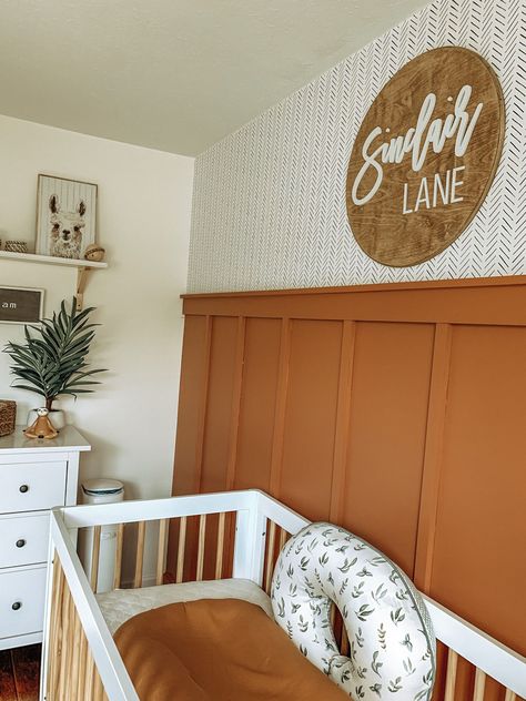 Boho Neutral Nursery in rust and white #nurserydecor #nurseryideas #nursery #babynursery Rust Nursery Ideas, Boho Accent Wall Nursery, Rust Gender Neutral Nursery, Orange Accent Wall Nursery, Rust Nursery Decor, Orange Nursery Ideas Gender Neutral, Fall Theme Nursery, Rust Orange Nursery, Boho Baby Nursery Gender Neutral