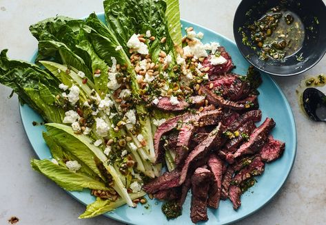 Salsa verde made with scallions, mint, parsley, capers and garlic becomes both the marinade for the steak and the dressing for the greens in this summery dinner salad. For extra smoky flavor, try grilling the romaine hearts (drizzle with olive oil and grill, cut side down, until lightly charred). Roasted Plantains, Romaine Hearts, New York Times Recipes, 5 Star Recipes, Nyt Recipes, Eggplant Salad, Bitter Greens, Zucchini Salad, Sliced Steak