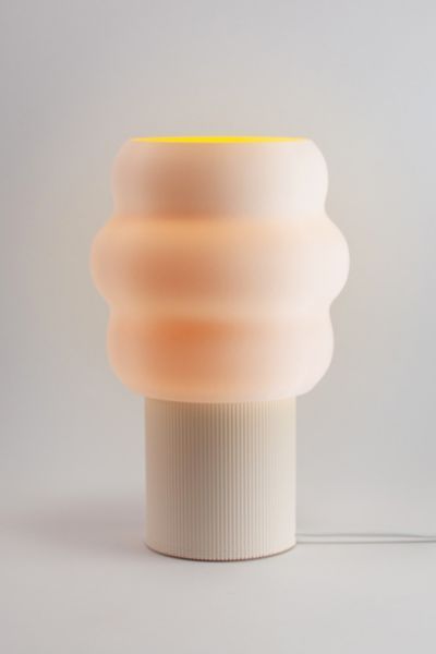 The Jelli Table Lamp finds its creative spark in the playful contours of soft serve ice cream, resulting in a design that’s whimsical and unique. The warm glow will bring happy vibes to any space. The Jelli Table Lamp is a great addition to your working desk or bedside table. The Jelli Table Lamp is designed, 3D printed, and hand assembled by Honey and Ivy Studio in Portland, Oregon. The 3D printing process is similar to making ceramic pottery in that each printed part is unique and has its own Boston Apartment, Furniture Apartment, Bead Loom Designs, 3d Printer Designs, Uo Home, 3d Lamp, Soft Serve Ice Cream, Apartment Furniture, Beautiful Lighting