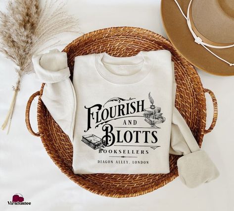 Harry Potter Flourish Blotts Sweatshirt, Bookish HP Fan Shirt Check more at https://viralustee.com/product/harry-potter-flourish-blotts-sweatshirt-bookish-hp-fan-shirt/ Harry Potter Shirt, Harry Potter Shirts, Book Clothes, Embroidery Sweatshirt, Fan Shirts, Harry Potter, Fan, Embroidery, Sweatshirts