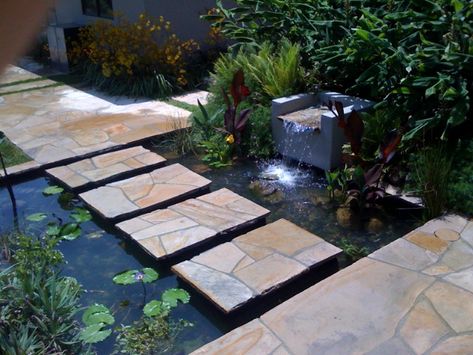 Pond With Stepping Stones, Pond Stepping Stones, Resort Entrance, Pool Ladders, Stepping Stone Path, Garden Path Lighting, Indoor Pond, Path Lighting, Stone Garden Paths