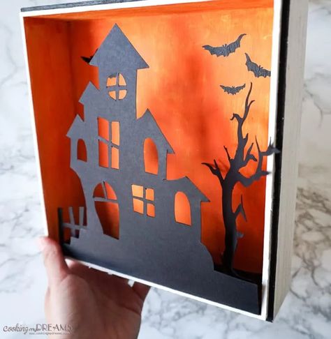 This is what your Halloween decor was missing! A cute wooden Halloween shadow box with a haunted house, a spooky tree and eerie lights. It's really easy to make, also together with your kids! Check the step-by-step instructions, hyper-lapse video and download the printable template for the silhouettes to have your new Halloween decoration in no time! #easycraft #halloweendecoration #diyhomedecor #spookydecor Hyperlapse Video, Alice Halloween, Halloween Shadow, Halloween Shadow Box, Bricolage Halloween, Spooky Tree, Halloween Creative, Casa Halloween, Homemade Halloween Decorations