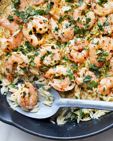 The universal appeal of shrimp scampi, frankly, isn’t the shrimp but the pan sauce: garlicky butter lightened with white wine and bursts of lemon, parsley and red-pepper flakes. Scampi is often tossed with pasta or served with crusty bread, but this version instead uses quick-cooking orzo. Shrimp Scampi With Orzo, How To Cook Orzo, Shrimp Scampi Recipe, Orzo Recipes, Pan Sauce, Nyt Cooking, Shrimp Dishes, Shrimp Scampi, Crusty Bread