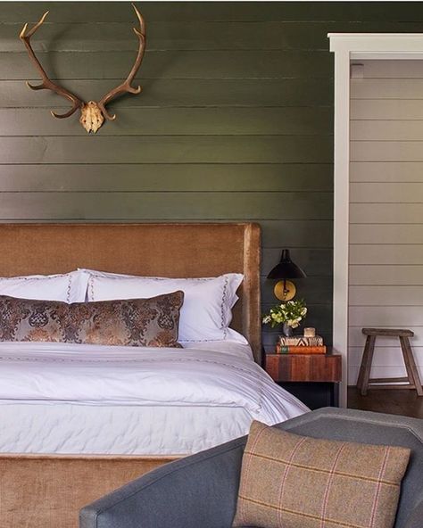 Love the green shiplap here in this beautiful bedroom design + velvet headboard + antlers above bed + dark and moody bedroom + green walls + olive green + lumbar pillow on the bed | Courtney Giles Interiors Cabin Bedrooms, Mountain Bedroom, Modern Rustic Bedrooms, Rustic Decorating, Cabin Bedroom, Modern Rustic Decor, Atlanta Homes, Modern Cabin, River House