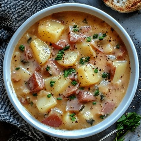 Kielbasa Soup with Potatoes is a warm and hearty dish perfect for cooler weather or when you’re craving a comforting, satisfying meal. This soup is packed with the smoky flavor of kielbasa, tender potatoes, and the rich blend of Parmesan and cheddar cheeses. Fresh vegetables and garlic enhance the flavor, making this soup a balanced […] Soup Recipes Kielbasa, Potato Kielbasa Soup, Kielbasa Potato Soup, Potato Kielbasa, Kielbasa Rice, Soup With Potatoes, Kielbasa Soup, Kielbasa And Potatoes, Kielbasa Sausage