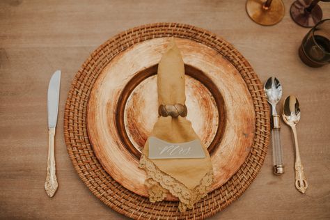 Thrifted decor, wicker charger plate, with gold charger plate on top and accented with gold and silver flatware. Thrifted Wedding, Wedding Plate Setting, Wedding Plate, Gold Charger Plate, Yellow Napkins, Thrifted Decor, Gold Decorations, Gold Chargers, Gold Flatware