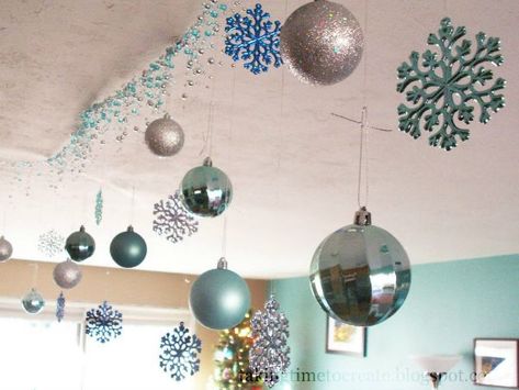 15 Christmas Ceiling Decorations To Make Christmas Special - Christmas has always been a much awaited affair and many have planned from the months up to Christmas about what they should do and how they should decorate their homes and offices. Christmas celebrations include … Christmas Ceiling Decorations Ideas, Christmas Ceiling, Winter Interior Design, Christmas Ceiling Decorations, Colorful Chandelier, Ceiling Decorations, Christmas Lights Garland, Christmas Creative, Ornament Garland