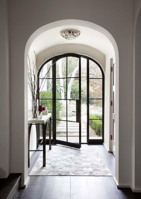 I am torn…I love a glass front door…specifically these steel framed doors…they let in light... Arched Front Door, Front Door Inspiration, Steel Front Door, Black Front Doors, Entry Ways, Door Inspiration, Front Door Entrance, Inspiring Interiors, Arched Doors