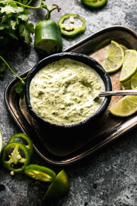 Peruvian Green Sauce (or Aji Verde) is a spicy + versatile, creamy condiment. Made with jalapeno, cilantro, lime juice + Greek yogurt. // recipe Peruvian Green Sauce Recipe, Slaw For Tacos, Peruvian Green Sauce, Peruvian Chicken Recipe, Fried Yuca, Green Sauce Recipe, Peruvian Chicken, Verde Sauce, Fried Green Beans