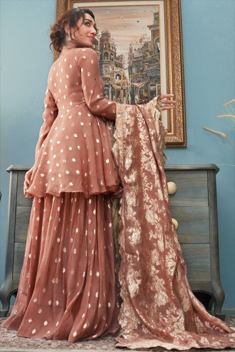 Aaina celebrates tradition and culture with a fusion of modernity in the most alluring shade of rose taupe designed on a luxurious embossed silk, with delicate and intricate crystal embroidery.  Coordinate and complete this look by adding this silk embossed sharara with a graceful flair (sold separately) and this silk embossed floral dupatta with kiran finishings (sold separately). Small Frocks, Floral Dupatta, Old Rose Color, Wedding Fits, Rust Fabric, Pakistani Culture, Rose Taupe, Short Frock, Crystal Embroidery