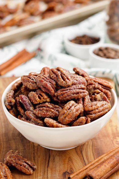 Candied pecans are one of those truly popular snacks for the festive season and sometimes other parts of the year as well. They date back all the way to 1636 and have only increased in popularity since.This classic Candied Pecans recipe is a great addition to your Holiday festivities. Great as a crunchy snack, on salads, as part of a charcuterie board or as a homemade gift. Made with cinnamon sugar and a few other warm spices, this EASY and simple recipe is sure to be a hit! Paleo Candied Pecans, Paleo Candy, Cinnamon Sugar Pecans, Sugar Pecans, Candied Pecans Recipe, Glazed Pecans, Sugared Pecans, Salad Toppers, Homemade Food Gifts