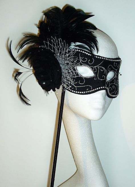 Black and Silver Masquerade Ball Mask, Hand crafted in 100% Silk dupion.     Perfect costume accessory, for alternative weddings, Mardi Gras, masquerade balls and special events.     This beautiful mask is embellished with Genuine Swarovski crystals, Silver veiling, medium cabbage rose and a hand crafted feather mount with stripped coque feathers, 3 ostrich arrows, roaster tail and hackle feathers. Finished off with a diamanté trim. Masquarade Mask, Alternative Weddings, Masquerade Ball Masks, Mardi Gras Wedding, Masquerade Ball Mask, Venetian Carnival Masks, Silver Mask, Ball Ideas, Ball Mask