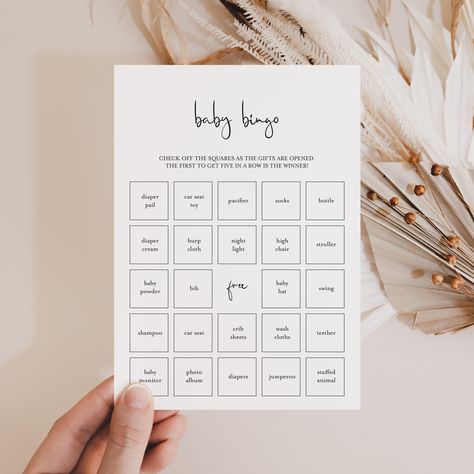 "Black & White Baby Shower Bingo Game Print on kraft paper for a rustic look. Let not only the mom-to-be enjoy unpacking gifts! Play Bingo with these modern minimalist baby bingo cards. Check off the squares as the gifts are opened. The first to get five in a row is the winner! The minimalist baby bingo game has everything you need to play Baby Bingo in multiple ways. A blank card to be filled in by your guests and 30 different pre filled bingo cards with calling sheet to make things easy. This baby shower bingo game is an instant download. Within minutes of your order and payment, an e-mail will be sent to the address you have associated with your Etsy account with a link for your download.   You can also access the files from your recent purchases on Etsy. Print the cards right from your Baby Shower Gift Game, Funny Baby Shower Games For Men, Baby Bingo Game, Baby Shower Bingo Game, Black Baby Shower Games, Baby Shower Card Games, Baby Shower Paper Games, Classy Baby Shower Games, Simple Baby Shower Games