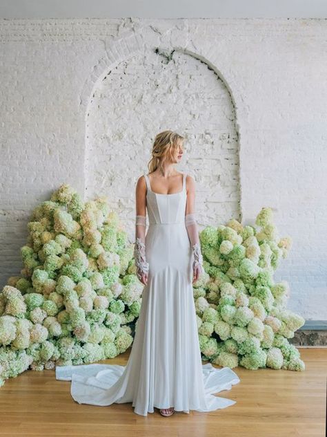 When you think corsets, you think dainty ladylike girls. But, this structured bodice has got some funk. This wedding dress by Carol Hannah has those feminine elements, but done in a rock star way. She even has arm warmers and tousled hair.  Click to see more fun, non-traditional wedding dresses selected from the bridal Fall 2020 season by destination wedding planner, Mango Muse Events! Square Neck Wedding Gown, Wedding After Party Dress, Carol Hannah Bridal, After Party Dress, Chic Wedding Gown, Carol Hannah, Wedding After Party, Destination Wedding Dress, Beaded Tulle