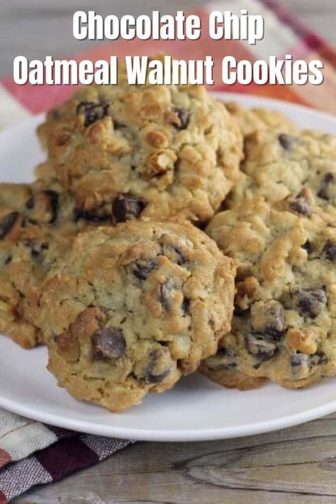 Chocolate Chip Oatmeal Walnut Cookies are delicious with a great texture. Made with semi-sweet chocolate chips, old fashions oats, and crunchy walnuts. #chocolatechipoatmealwalnutcookies #wordsofdeliciousness Chocolate Chip Cookies With Nuts And Oatmeal, Chocolate Chip Walnut Oatmeal Cookies, Oatmeal Nut Cookies, Oatmeal Chocolate Chip Walnut Cookies, Oatmeal Chocolate Chip Walnut Cookie Recipe, Oatmeal Walnut Chocolate Chip Cookies, Cookies With Walnuts Recipes, Oatmeal Raisin Walnut Cookies, Oatmeal Walnut Cookies