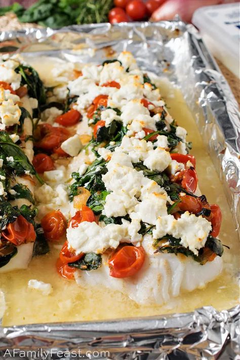 Baked Cod with Spinach, Feta and Tomatoes has tender baked fish topped with sauteed spinach and cherry tomatoes, plus crumbles of briny feta cheese. Fish Recipes Dinner, Cod With Spinach, Cod Fish Recipes, Mediterranean Diet Recipes Dinners, Fish Recipes Baked, Fish Dinner Recipes, Easy Mediterranean Diet Recipes, Spinach Feta, Joyful Life