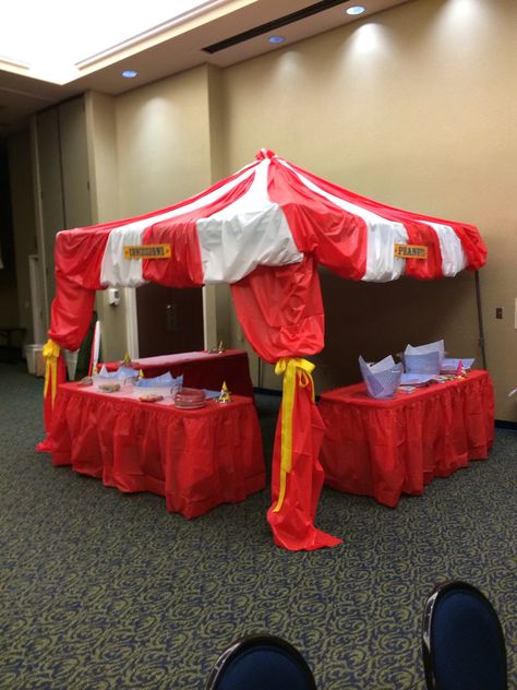 Circus tent - made with paper tablecloths.  Genius.  Don't forget the big yellow bows How To Make A Circus Tent, Diy Circus Tent Canopies, Diy Circus Tent Backdrop, Carnival Tent Diy Plastic Tablecloth, Ez Up Tent, Diy Carnival Tent Big Top, Carnival Vbs, Paper Tablecloths, Circus Tent Ceiling