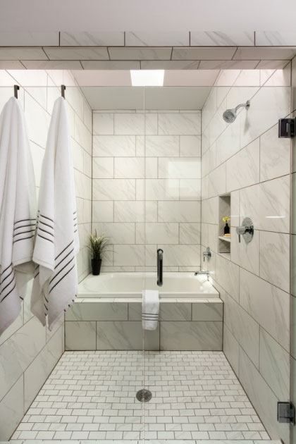 Cultured Marble Shower Surrounds or Tile? Here’s How To Decide. | Grabinski Group Carrara Tile Bathroom, Corner Bathtub Shower, Cultured Marble Shower Walls, Cultured Marble Shower, Marble Shower Walls, Bathroom Transitional, Bathtub Shower Combo, Marble Tub, Tub Enclosures