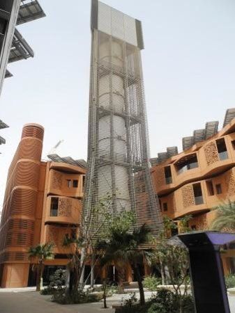 (contd). A 45-m tall tower harvests cooling breezes & pushes the air thru' the narrow city streets. Planners predicted Masdar City would accommodate up to 50,000 residents & 40,000 daily commuters by 2018.  Masdar City, Abu Dhabi Masdar City, Wind Tower, Transmission Tower, Sustainable Environment, Innovative Architecture, Sustainable City, Norman Foster, Passive House, Environmental Design