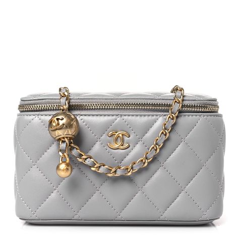 This is an authentic CHANEL Lambskin Quilted Small Pearl Crush Vanity Case With Chain in Grey. This stylish crossbody is crafted of luxurious lambskin in grey. It features a leather threaded aged gold chain-link shoulder strap and aged gold hardware. The handbag features a 3/4 wrap-around zipper that opens to a metallic gold fabric interior with card slots. 1381440 Chanel Vanity Case, Chanel Vanity, Small Vanity, Vanity Bag, Grey Bag, Fancy Bags, Vanity Case, Leather Thread, Gold Fabric