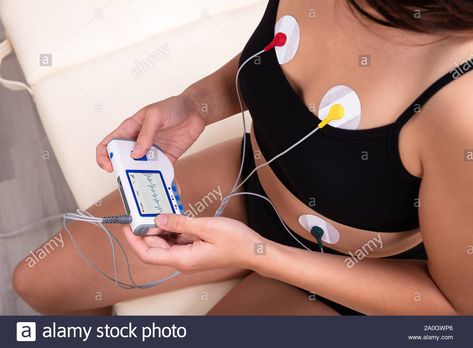 Download this stock image: Woman Wearing Holter Monitor Device For Daily Monitoring Of An Electrocardiogram - 2A0GWP6 from Alamy's library of millions of high resolution stock photos, illustrations and vectors. Holter Monitor, Cardiac Rehabilitation, Wearable Gadgets, Stock Photos Woman, Medical Device, Medical School, Wave Pattern, Medical Professionals, Product Launch