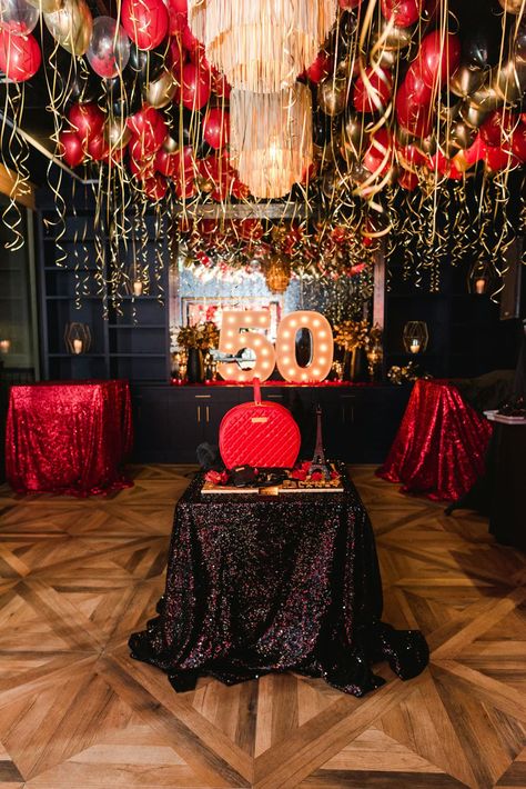 This spectacular red and gold 50th birthday party was a festive celebration filled with elegant décor and unique details. Held at 101 north eatery in Westlake Village, California, this event featured red and gold balloons, large red rose centerpieces, elegant gold platters, enormous marquee letters, and a detailed birthday cake. XO Bloom planned all of the décor and florals seen at this glamorous birthday party which created a cohesive, memorable event. Red And Black Event Decor, Red 60th Birthday Ideas, Black And Red 50th Birthday Party Ideas, Roses Birthday Theme, Black Gold And Red Party Decorations, Roses Themed Birthday Party, Black Red And Gold Party Decorations, 50th Birthday Party Ideas For Woman, Red And Gold Centerpieces