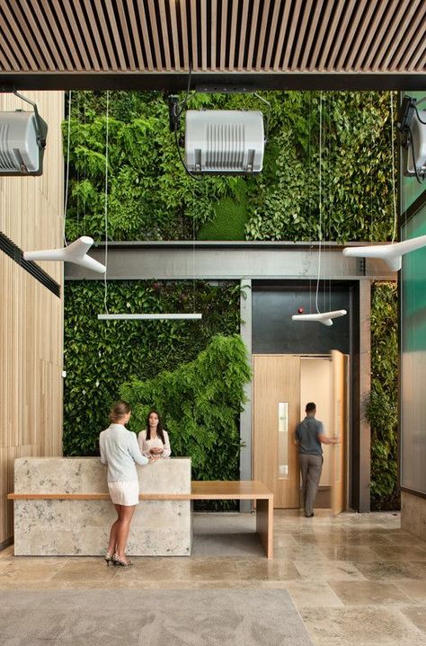 Green Office Ideas, Modern Lobby Design, Industrial Reception Desk, Plant Office Design, Green Office Decor, Reception Desk Office, Hotel Lobby Design, Reception Desk Design, Lobby Reception