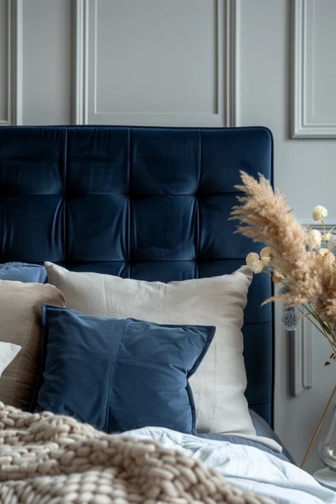 Transform your bedroom with stunning navy blue headboard ideas that add a stylish, fresh vibe to your space. From bold and contemporary looks to elegant, classic styles, discover different ways to incorporate this striking color into your decor. Whether you're interested in a royal navy velvet finish or modern shapes, we’ve got you covered! Create a relaxing retreat that showcases your personality while enhancing warmth and comfort. Take inspiration from these creative bedroom setups and kiss dull interiors goodbye. Bedroom With Blue Bed Frame, Midnight Blue Headboard, Royal Blue Headboard, Bedroom Blue Headboard, Navy Blue Headboard Bedroom Ideas, Blue Headboard Bedroom Ideas, Blue Headboard Bedroom, Navy Blue Headboard, Headboard Bedroom Ideas