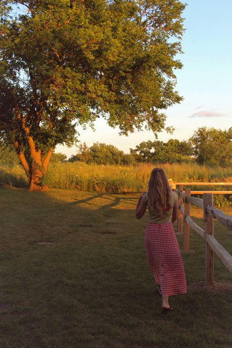 Country vibe in the summer walking on a farm field in a maxi skirt gingham pattern with trees at sunset in the Midwest near a lake cabin Wisconsin Aesthetic, Midwestern Summer, Season Of The Sticks, Farm Girl Outfits, Stop Romanticizing, 12 Grapes, Miley Stewart Summer, Midwest Summer, Country Girl Aesthetic