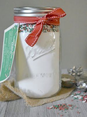 These sweet sugar jars are loaded with festive sprinkles that are ready to be baked into sugar cookies. They make great gifts for teachers, friends or the big man himself! #christmas #christmascookies #giftsideas #diy #giftsinjars Sugar Cookie In A Jar Recipe, Gifts In Jars, Mason Jar Cookie Recipes, Cookie Mix Jar, Cookie Mix In A Jar, Cookie Jar Gifts, Blogger Ideas, Mix In A Jar, Mason Jar Cookies