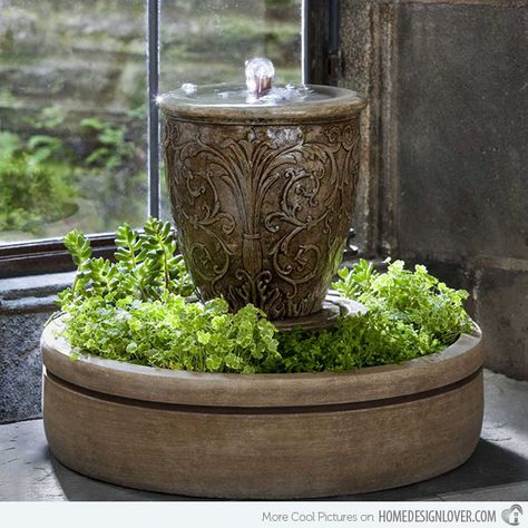 The details in this urn with fountain are very beautiful. It is even enhanced with the addition of green plants at its bottom. Small Indoor Water Fountains, Diy Solar Fountain, Diy Water Feature, Taman Air, Indoor Water Features, Diy Water Fountain, Tabletop Water Fountain, Fountains Backyard, Diy Fountain