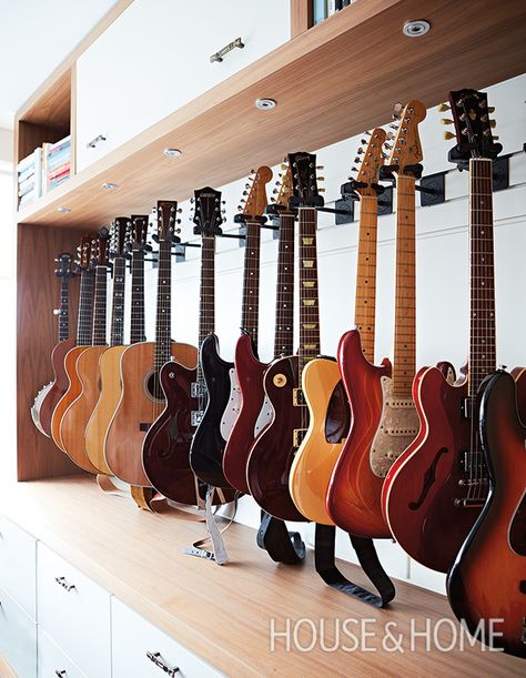 Get our best tips and tricks to beautifully displaying personal collections. | Photographer: Angus Fergusson | Designer: U31 Guitar Wall Display Ideas, Display Guitars On Wall, Guitar Display Ideas, Hanging Guitars On Wall Ideas, Guitar Storage Cabinet, Basement Music Room, Guitar Display Wall, Track Shelving, Office Music Room