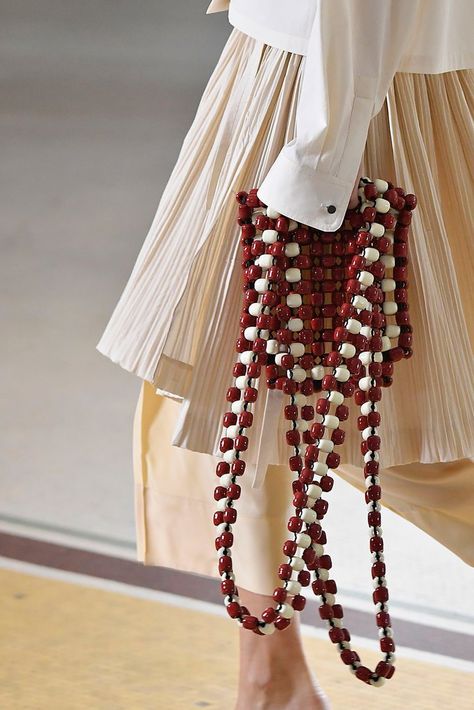 Lemaire The fun, hippie-ish spirit of a ’70s-inspired beaded bag feels perfectly modern, thanks to long straps and large wooden beads. Ideas Clothes, Authentic Designer Handbags, Clothes Diy, Beaded Bag, Burberry Handbags, Best Bags, Chic Accessories, Beaded Bags, Bijoux Diy