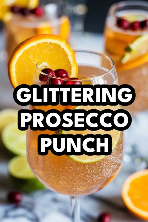 A photo of a  Glittering Prosecco Punch a New Years Cocktails New Years Party Punch Alcohol, New Years Eve Punch Alcoholic, Prosecco Cocktails New Years Eve, Nye Cocktails For A Crowd, New Year’s Eve Sangria, Welcome Drink Ideas Parties, New Years Cocktails For A Crowd, New Year’s Eve Alcoholic Punch, Cocktails With Edible Glitter