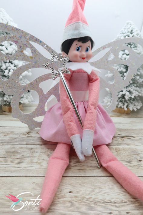 Elf wearing a fairy costume with a pink dress, a white sash, glittered wings, and a silver star wand Elf Fairy Costume, Elf Halloween Costume, Silver Halloween Costume, Whimsical Costume, Elf Halloween, Pets Stuff, Elf Pets, Elf Fairy, Elf Activities