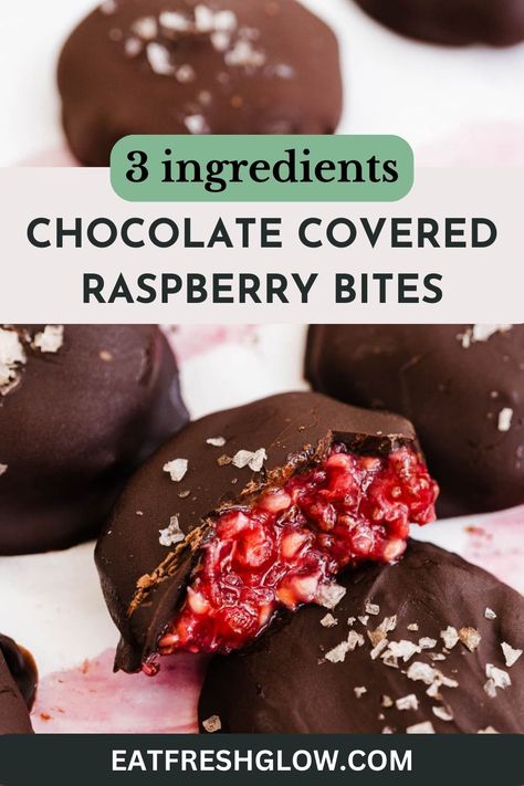 Chocolate raspberry bite cut in half to reveal filling with more bites surrounding. Chocolate Raspberry Clusters, Chocolate Berry Bites, Dark Chocolate And Fruit Healthy Snacks, Chocolate Covered Raspberries Recipe, Healthy Dessert Raspberry, Frozen Raspberry Yogurt Bites, Healthy Chocolate Covered Fruit, Raspberry Coconut Balls, Chocolate Covered Raspberry Bites