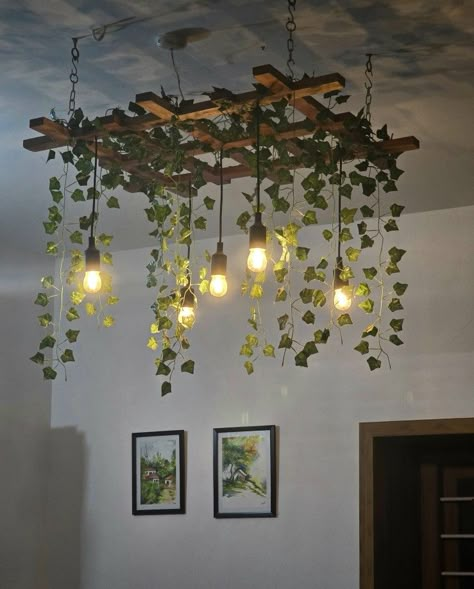 Hanging Lights With Plants, Plants With Lights Decor, Hanging Lights Design, Decor With Fairy Lights, Diy Hanging Chandelier, Hanging Chandelier Over Table, Pipe Decoration Ideas, Wooden Hanging Decor, Plants From Ceiling