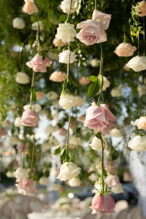 Dreamy blush and white roses suspended beautifully above a sophisticated tablescape. A soft, romantic touch for any wedding theme. Pink Rose Wedding Theme, Romantic Garden Wedding Decor, Pink Wedding Aesthetic, Pink Wedding Florals, Fairytale Garden Wedding, Pink Themed Wedding, Rose Centerpieces Wedding, Garden Themed Wedding, Hanging Rose