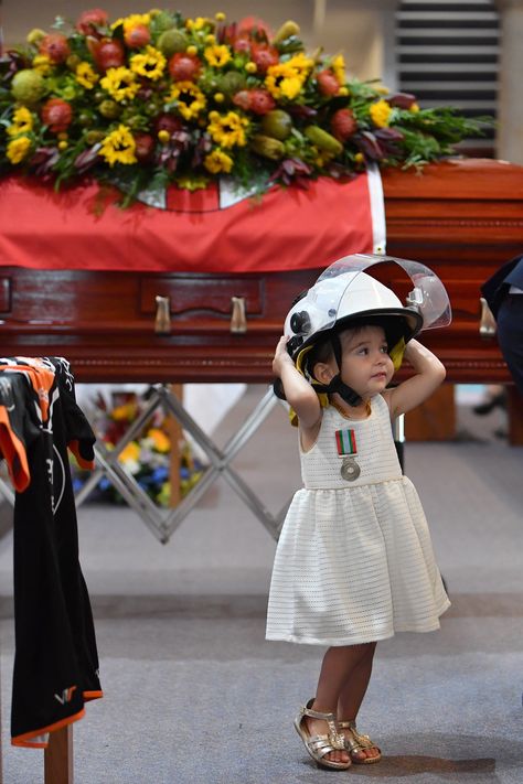 Charlotte O'Dwyer, the young daughter of Rural Fire Service volunteer Andrew O'Dwyer stands in front of her fathers casket wearing his helmet. Firefighters Daughter, Volunteer Firefighter, Fire Fighters, Fire Brigade, Fire Fighter, Fire Service, Live In The Present, Smile Girl, Animated Images