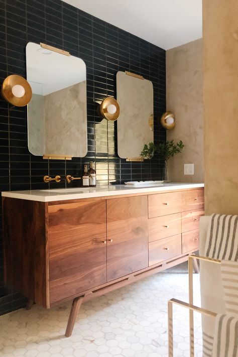 Moody midcentury modern bathroom.  Walnut vanity.  Dark navy stacked tiles.  Calacatta Gold Marble hexagon tile floor.  #bathroom #bathroomideas #bathroomdesign #midcenturymodern #bathroomrenovation Hoss Homestead, Parisian Bathroom, Hello Tuesday, Mid Century Modern Bathroom, Mid Century Bathroom, Wooden Vanity, Bad Inspiration, Bathroom Goals, Bathroom Renos