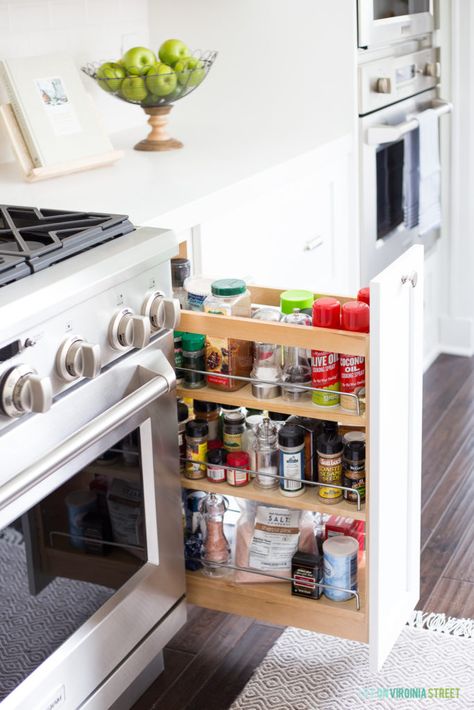 White kitchen cabinets with a pull-out spice rack! Spice Organization Ideas, Pull Out Spice Rack, Kitchen Post, Kitchen Spice Racks, Kitchen Pulls, Cottage Kitchens, Kitchen Spices, Spice Organization, Coastal Kitchen