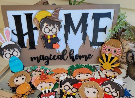 HOME Magical HOME Take a look at this magical wizard interchangeable HOME sign. The sign features our favorite wizards helping to celebrate the seasons and holidays with us! The sign includes the base with 12 different wizards that include a hook and loop fastener for easy change. This sign DOES NOT INCLUDE hanging hardware but you could add command strips to it or keep it displayed in a stand (not included). The choice is yours. You can purchase this as a complete bundle or in smaller pieces to complete your collection over time. For bundles, you may pick the pieces that YOU want. Please remember our items are hand-painted and crafted meaning there could be small imperfections or changes in color based on screens. Please feel free to ask any questions before purchasing and we hope this he Cute Wooden Signs, Harry Potter Welcome Sign Front Door, Interchangeable Home Sign, Harry Potter Christmas Wood Signs, Harry Potter Signs Wooden, Harry Potter Wood Signs, Interchangeable Home Sign Diy Cricut, Home Interchangable Signs, Home Sign With Interchangeable O