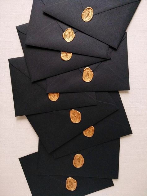 antique gold fairy wax seal, gold calligraphy guests addresses, blackest black envelopes, timeless beauty Black Envelope Gold Wax Seal, Black And Gold Envelope, Black And Gold Packaging, Great Gatsby Prom Theme, Black Box Packaging, Gold Ticket, Black And Gold Invitations, Punk 57, Elegant Envelope