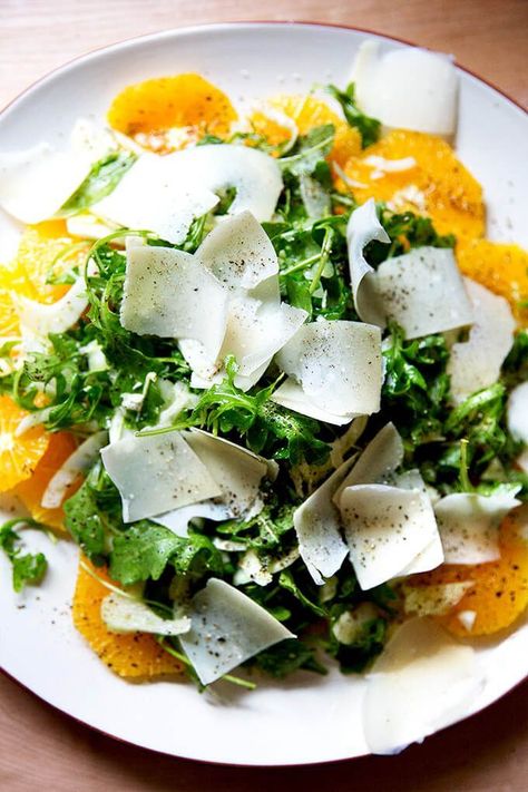 In this fresh and bright wintry salad, sliced oranges are topped with a mix of arugula, sliced fennel, and shaved parmesan in a shallot vinaigrette. #salad #saladrecipes #vegetarian Salad With Fennel, Sliced Oranges, Shallot Vinaigrette, Fennel And Orange Salad, Shaved Parmesan, Orange Salad, Winter Salad, Noodle Salad, Arugula Salad