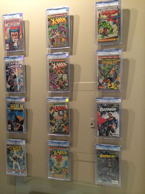 Great use of the ComicMounts for one of our guests CGC collection!  The "Floating" effect looks great and shows everyone a NEW way to design on those open walls.  www.comicmount.com Comic Book Display Ideas, Display Comic Books, Comic Exhibition Display, Comic Book Wall Display, Comic Book Gallery Wall, Comic Book Display Shelves Wall Mount, Comic Book Rooms, Comic Storage, Comic Display