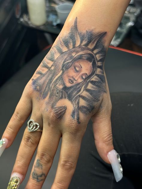 San Judas Hand Tattoo, Hand Tattoos For Women Meaningful, Virgen Mary Tattoo For Women, Mary Hand Tattoo, Virgin Mary Hand Tattoo, Our Lady Of Guadalupe Tattoo, Hispanic Tattoos For Women, Face Hand Tattoo, Thug Tattoos For Women