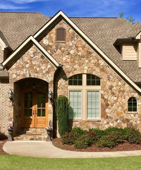 Natural Stone vs. Manufactured Stone: Pros & Cons Rock House Exterior, Sandstone Rock, Masonry Tools, Rock House, Cladding Systems, Metal Cladding, House On The Rock, Manufactured Stone, Historical Monuments