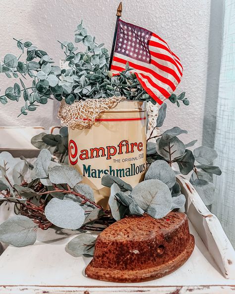 Welp, I found one! The elusive Campfire Marshmallow tin. She’s not perfect, but she was affordable at $22!🙌🏻 She’s extremely yellowed. It was even worse than you see here. When she arrived, she smelled of cigarette smoke and was extremely yellow. I believe she lived in a smoker’s house. I scrubbed her up the best I could. Promptly and proudly I displayed her with a sweet little silky American flag. Yall don’t sleep on Etsy, sometimes you just come across that treasure you’ve been looki... Campfire Marshmallow Tin Decor, Thrifting Home, Red White And Blue Decor, White And Blue Decor, Campfire Marshmallows, American Patriotism, Stiff Neck, Thrift Haul, Thrift Flip